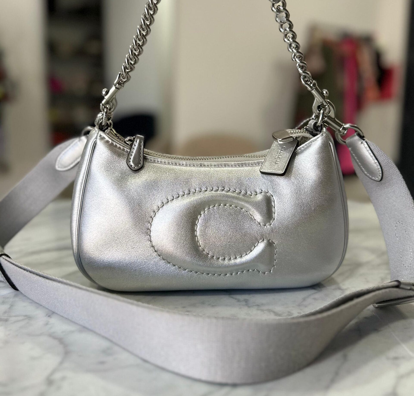 CARTERA COACH CUERO PLATEADO