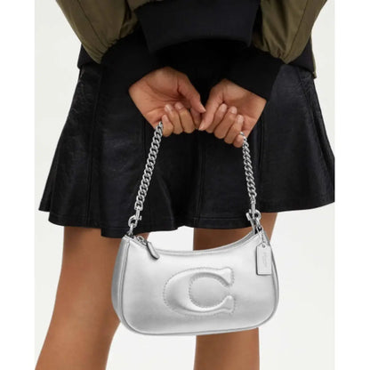 CARTERA COACH CUERO PLATEADO